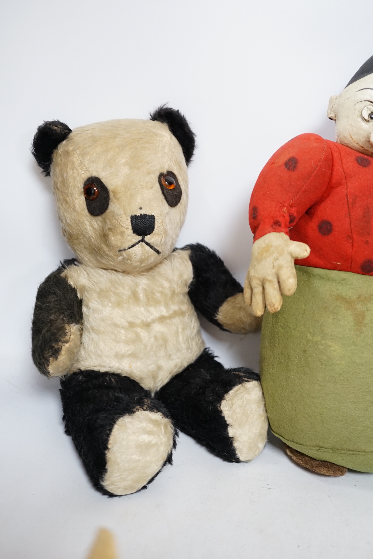 A Katzenjammer Kids 'Misses', felt body and composition face, 36cm high, a Chiltern panda, 1950's, and a Merrythought bull, 1950's (hair loss)